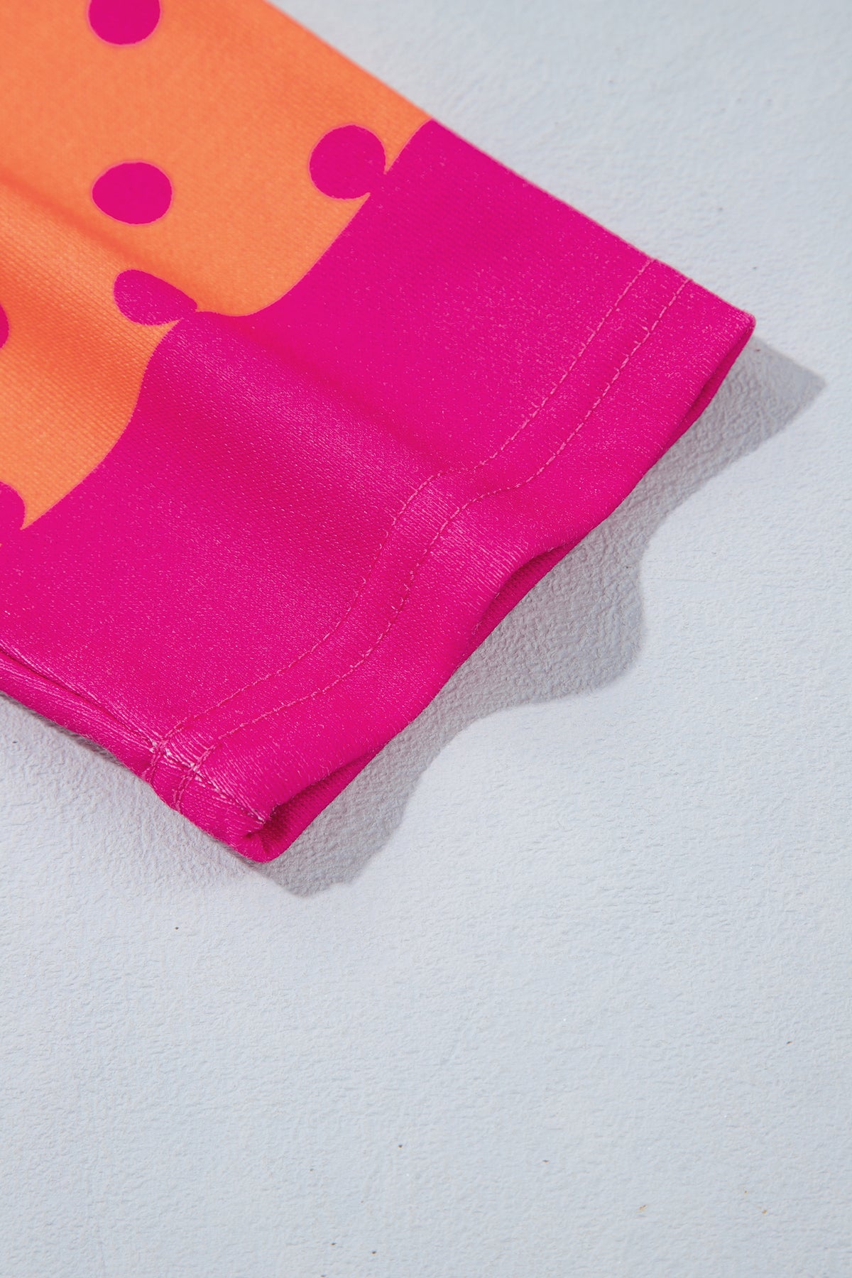 Peachy Keen pink and orange polka dot quarter zip pullover